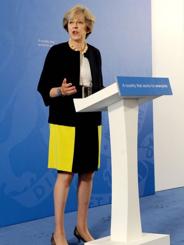 British PM criticized for wearing leopard print high heels